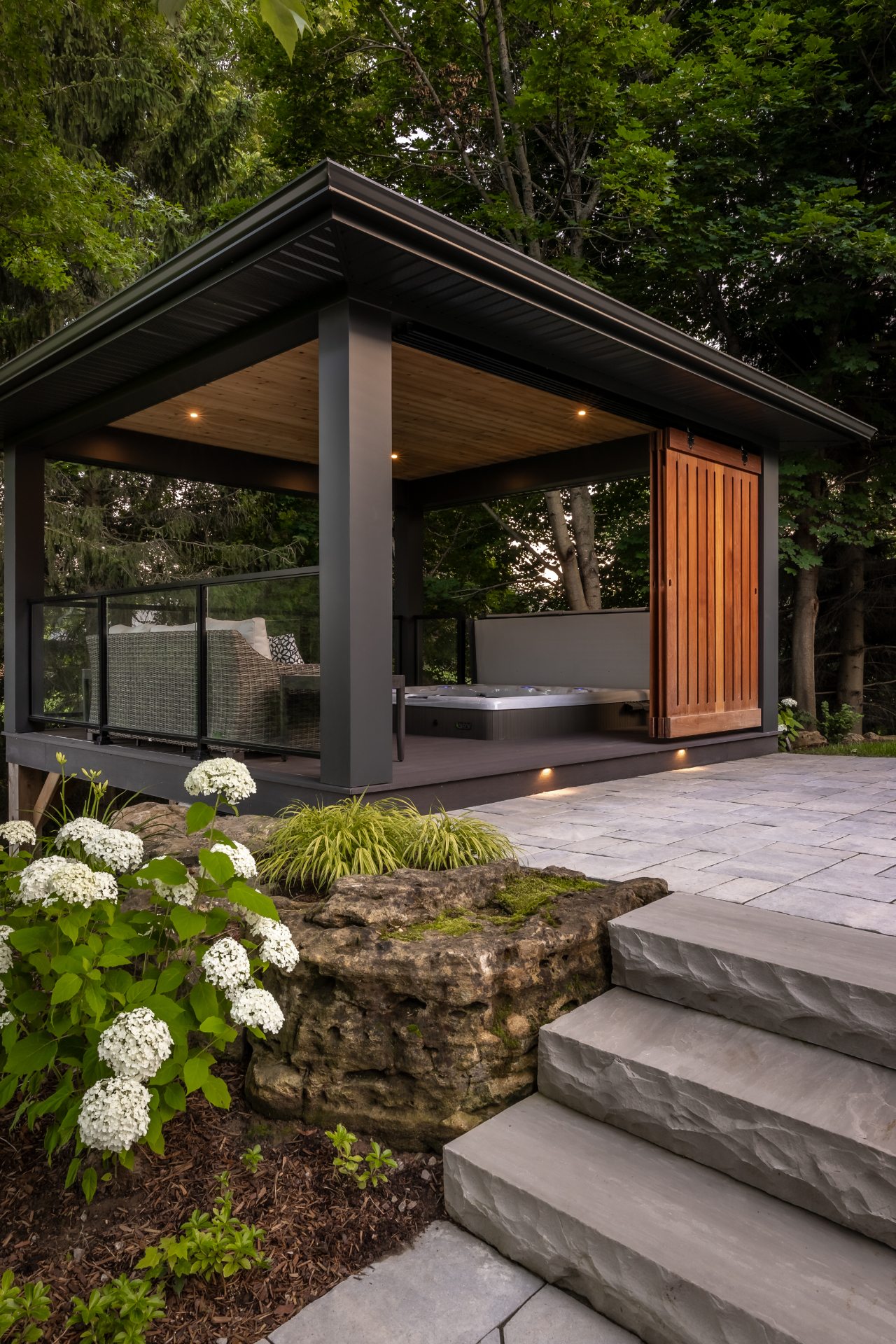 Modern hot tub pavilion with cedar privacy screen
