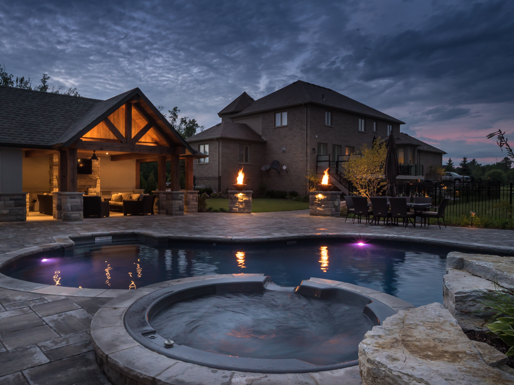 Integrated hot tub with fire bowls and pavilion