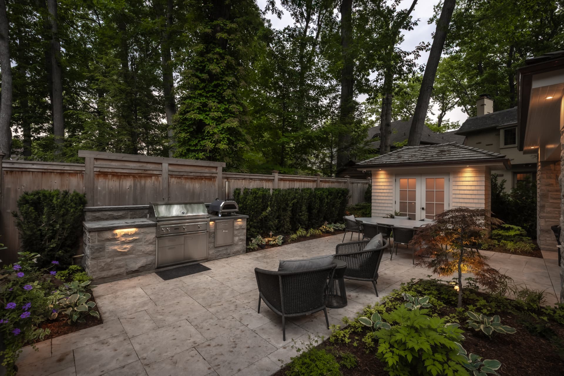 The Renaissance Retreat — Outdoor kitchen and patio dining