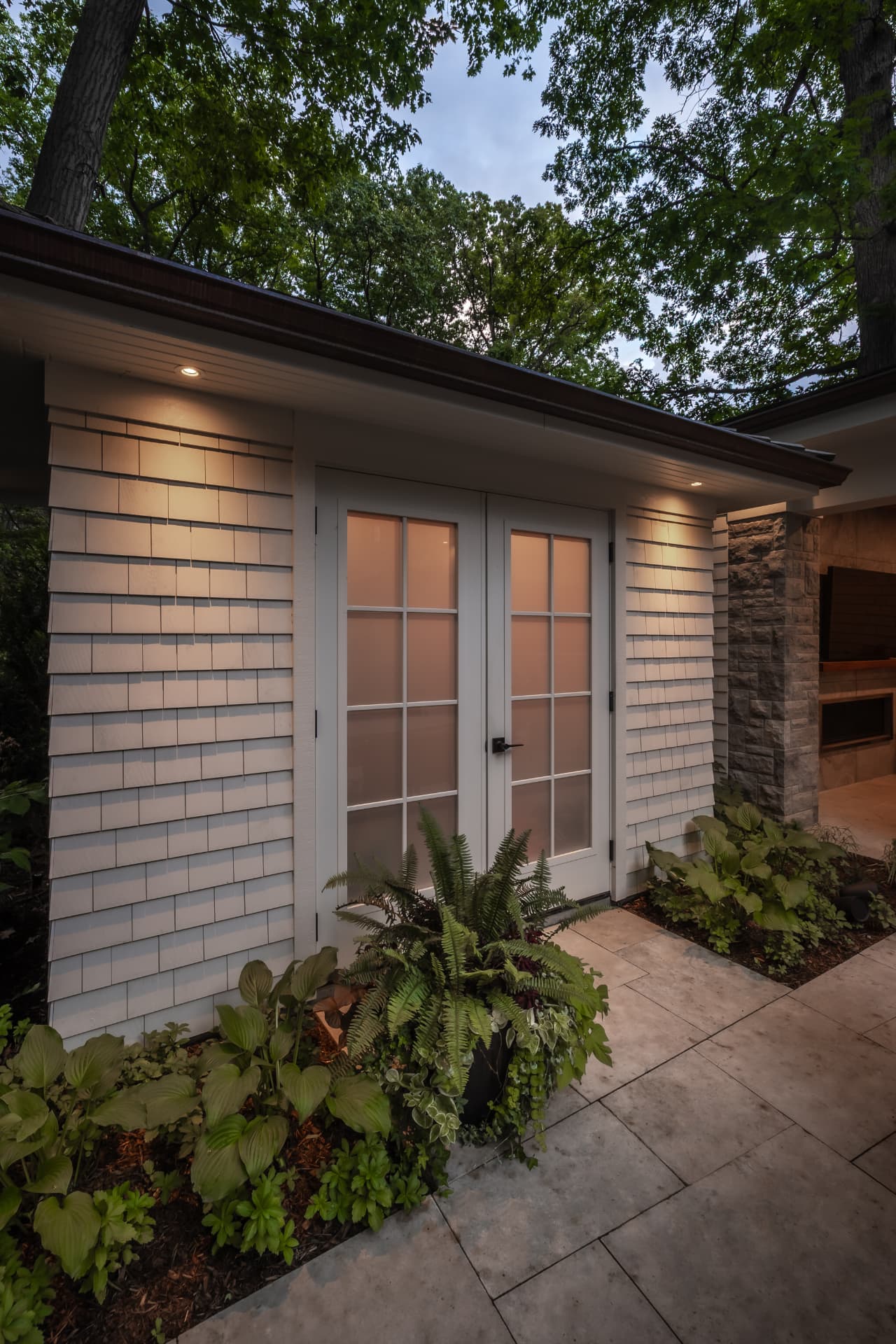 The Renaissance Retreat — Poolhouse entry with layered plantings