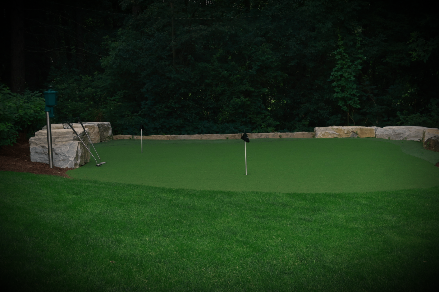 Private green framed by natural stone