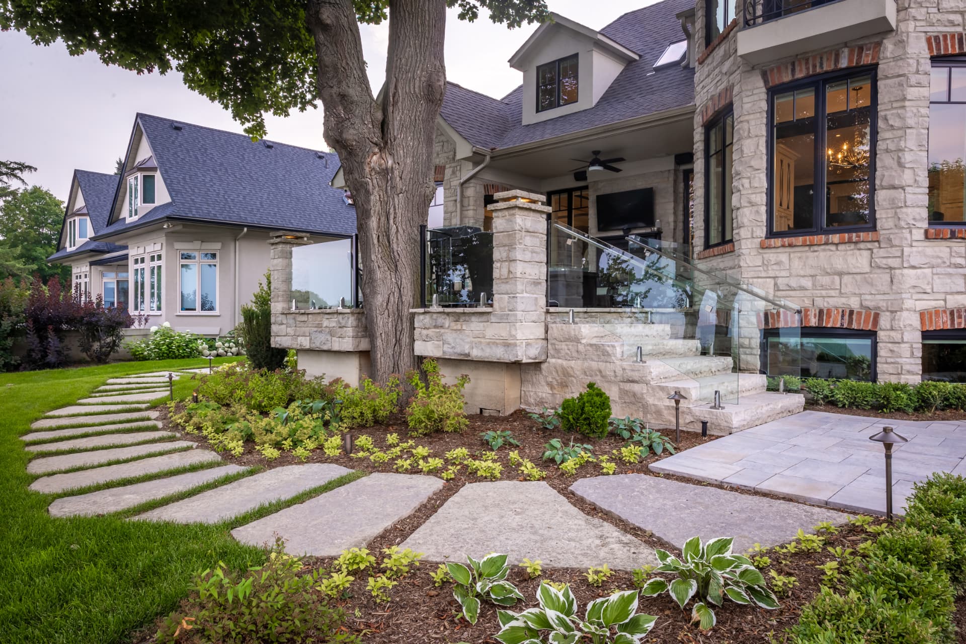 Natural stone stepping path leading to a stone estate entrance