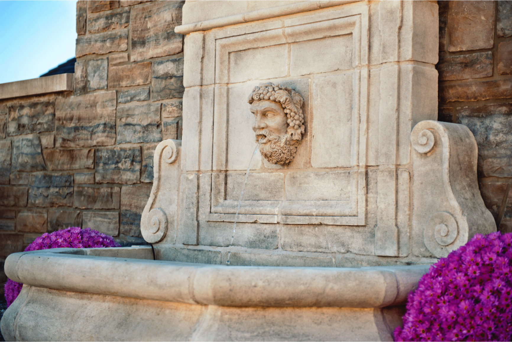Classical stone fountain with sculpted details