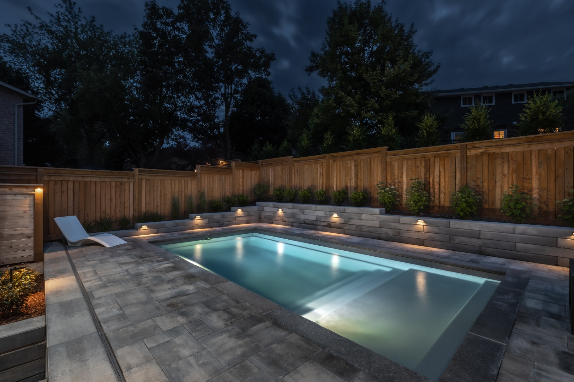 Modern rectangular pool with tiered planters